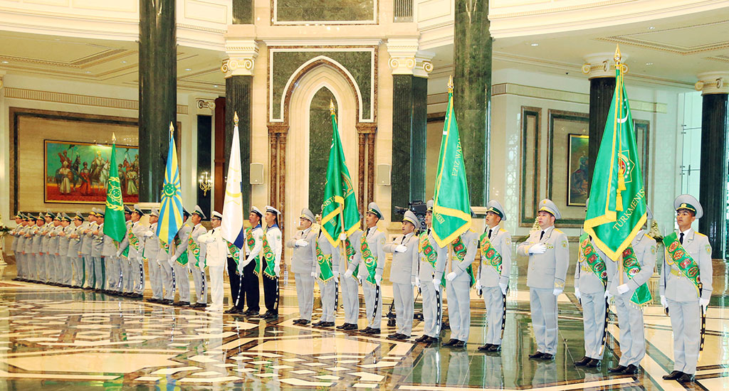 The President of Turkmenistan hands in the colours of military divisions of theArmed Forces 