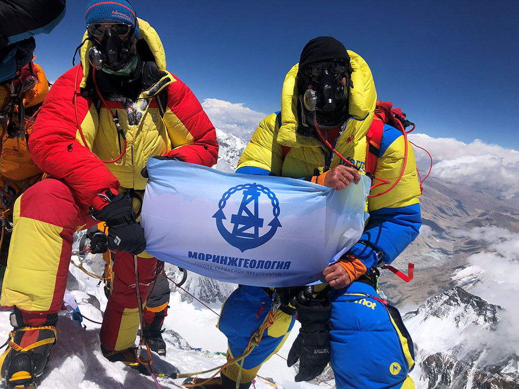 Flag of Turkmenistan is raised to the world's highest mountain - Mount Everest 